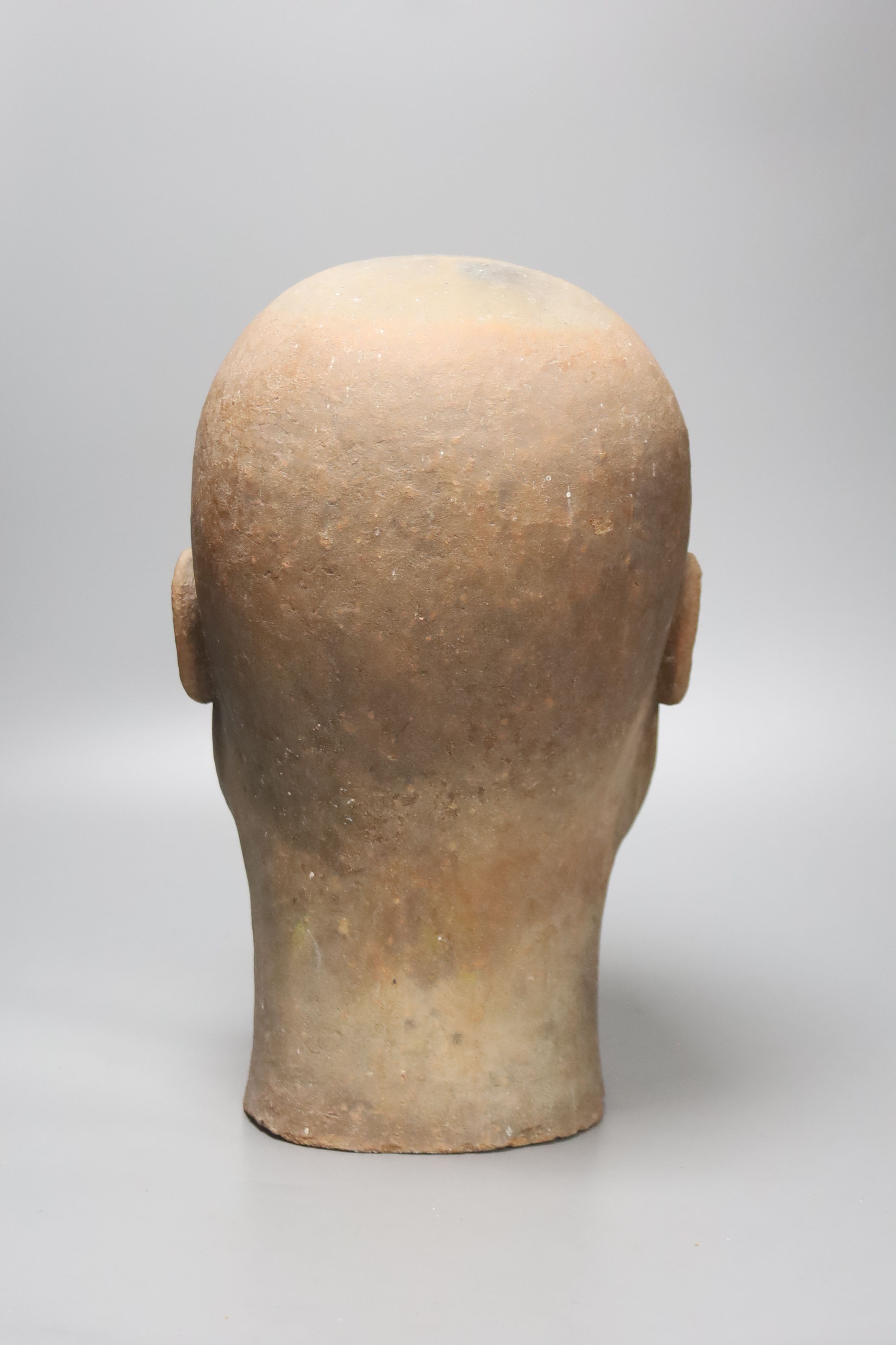 A large decoative terracotta head, 33cm high